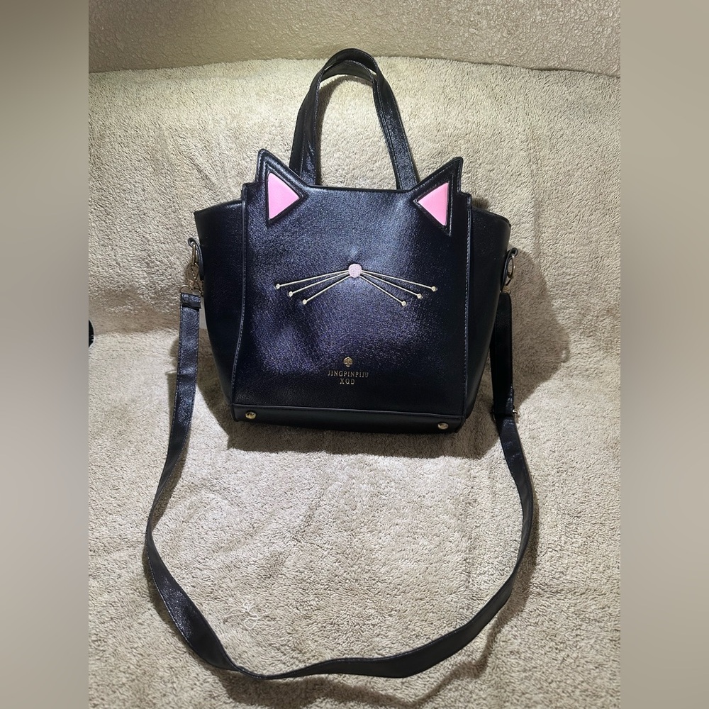 Black cat ears/whisker purse. Easy to clean with wet rag. Used only 3 times.